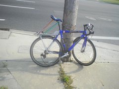 Bicile locked to a pole near accident zone Good view of bicycle daneges.JPG