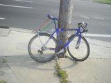 Bicile locked to a pole near accident zone Good view of bicycle daneges.JPG